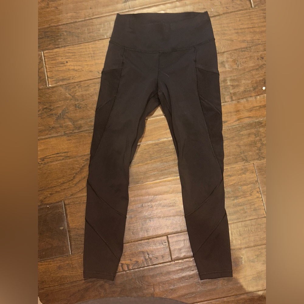 Lululemon Size 6 Black leggings with mesh cut out